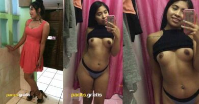 teen girl in dressing room taking pictures of her tits