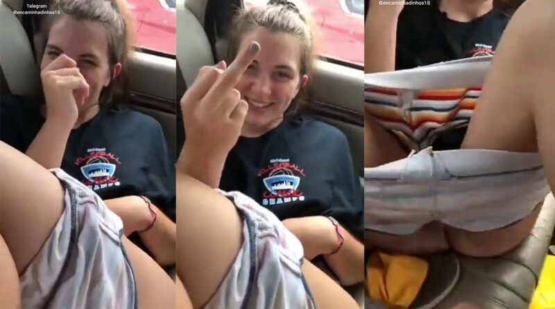 Girl in the car, she lowers her shorts and they touch her pussy